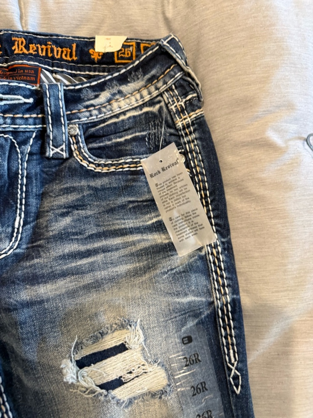 Rock Revival Navy Blue Distressed Jeans with White Stitching - Picture 2 of 5